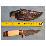 Trailing point knife. Composite handle w/guard.