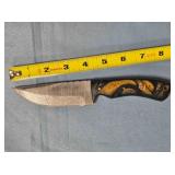 Drop point knife w/jimping on spine.