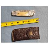 Lockback folding knife w/jimping on spine.