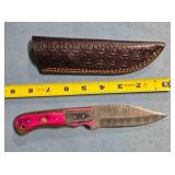 Drop point hunting knife w/jimping on spine.