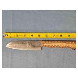 Drop point kitchen knife w/carved wood handle.