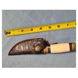 Trailing point blade knife. Blade guard.