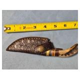 Trailing point blade knife. Blade guard.