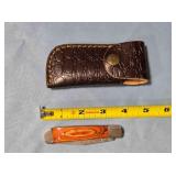 Folding knife w/wood handle. Damascus steel.