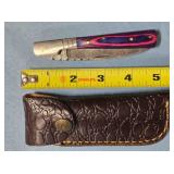 Drop point folding knife w/jimping spine.