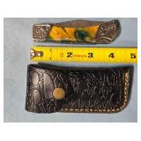 Clip point folding knife w/jimping spine.