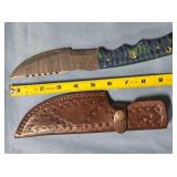 Straight blade knife w/serrated spine.