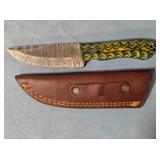 Straight blade knife w/light jimping on spine.