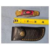 Lockback knife w/wood handle & spine jimping.