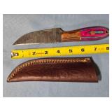 Straight blade knife w/two tone wood handle.