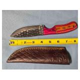 Drop point blade knife w/two-tone wood handle.