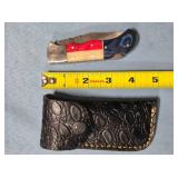 Lockback folding knife w/jimping on spine.