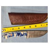 Straight point knife w/jimping on spine.