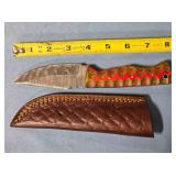 Drop point knife w/light jimping. 8" length.