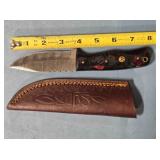 Drop point knife w/light jimping. 8" length.