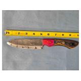 Drop point blade knife. Two tone wood handle.