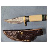 Trailing point blade knife. Composite handle.