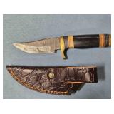 Trailing point blade knife. Blade guard.