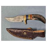 Trailing point blade knife. Blade guard.