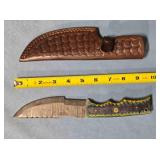 Drop point knife w/thumb rest on spine.