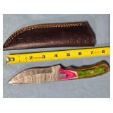 Drop point knife w/jimping on spine.