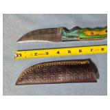 Trailing point knife w/two tone wood handle.
