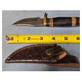 Trailing point blade knife w/guard. Light jimping.