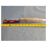 Drop point blade knife. Carved wood handle.