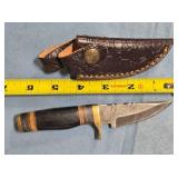 Straight blade knife w/jimping on spine.