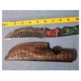 Trailing point knife w/serrated blade.