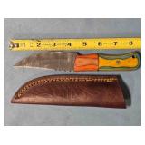 Straight blade knife w/wood handle & thong hole.
