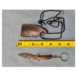 Recurve knife w/keychain & stamped leather sheath.