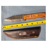 Drop point blade knife w/jimping on spine.