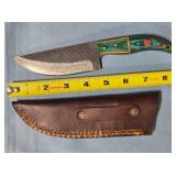 Straight blade knife w/two tone wood handle.