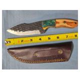 Drop point blade knife w/thumb rest on spine.