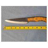 Drop point kitchen knife. Carved wood handle.