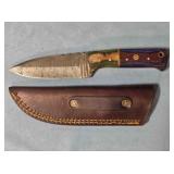 Drop point knife w/jimping. 8" length.