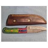 Drop point knife w/wood handle & thong hole.
