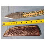 Drop blade knife w/carved wood handle.