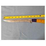 Fileting knife. Two-tone wood handle.