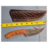 Straight blade knife w/gut hook. Damascus steel.