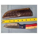 Drop point blade knife w/red, white & blue handle.
