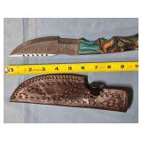 Straight blade knife w/serrated spine & thumb rest