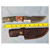 Straight blade knife w/serrated spine & thumb rest