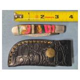 Folding pocket knife w/drop point blade.