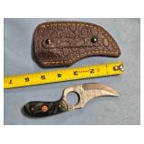 Trailing point knife w/finger hole in blade.