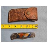 Lockback folding knife w/jimping on spine.