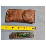 Lockback folding knife w/jimping on spine.