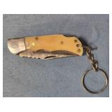 Small lockback folding Bowie-style knife