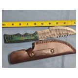 Hunting knife w/serrated blade & thumb rest.